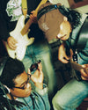 3 men playing instruments in a recording session