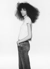 Woman wearing white t-shirt and denim jeans