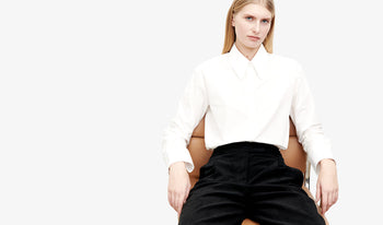 A.P.C. Women's Blouses & Shirts - Woman wearing white dress with puffy shoulders.