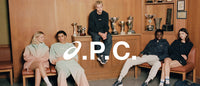 A.P.C. Asics - Group of young people wearing Asics and sitting in a school trophy room. 