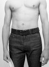 Shirtless man wearing denim jeans with belt