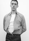 man wearing shirt and denim jeans