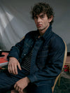A.P.C. GAP - man wearing A.P.C. GAP at a cafe