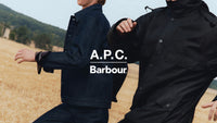 A.P.C. Barbour - couple in Barbour jackets running in a field