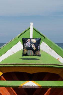 Pillow suspended above wooden boat