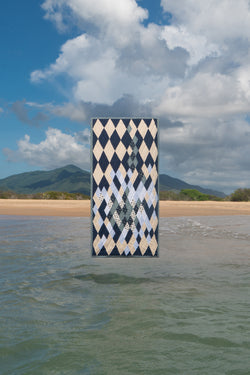 Quilt suspended above the beach