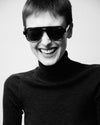 Woman wearing sunglasses laughing