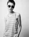 Woman in tanktop wearing sunglasses