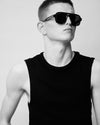 Man in tank top wearing sunglasses