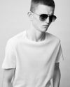 Man in white t-shirt wearing sunglasses