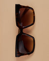 Sunglasses on beige background