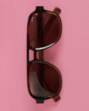 Sunglasses on pink background