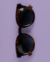 Sunglasses on purple background