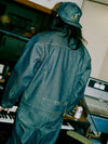 Man wearing denim cap, jacket, and jeans in a recording studio