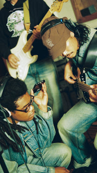 3 men in a song recording session