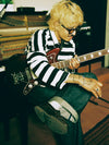 Man sitting playing guitar