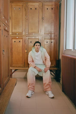 A.P.C. Asics - man model wearing tracksuit in a locker room