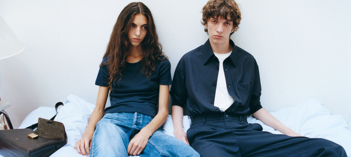 A.P.C. New Collection - couple sitting on couch in a fall 26 outfit