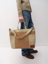 A.P.C. model holding tote bag