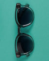 Sunglasses on turquoise background